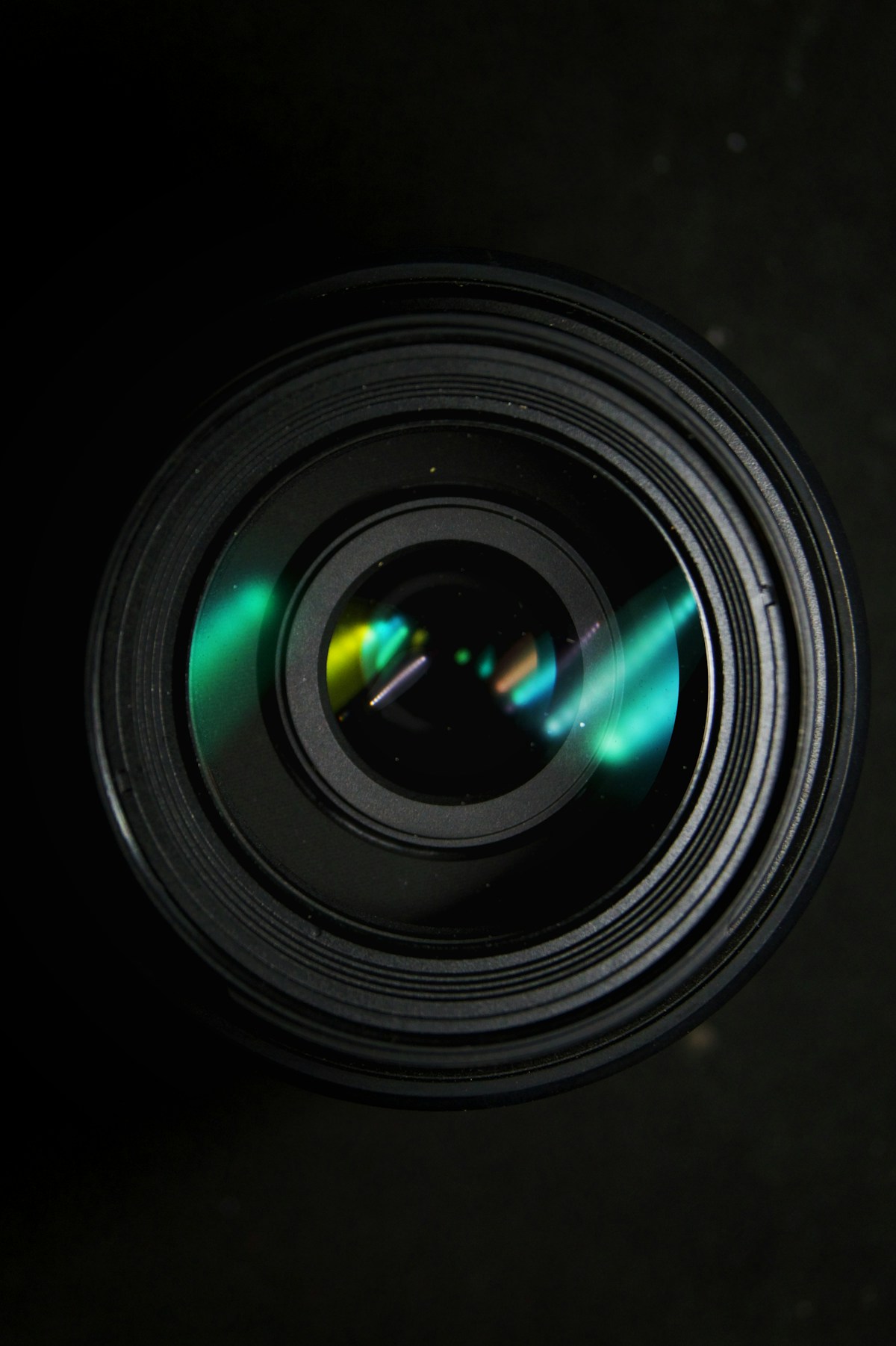Camera lens reflecting green light